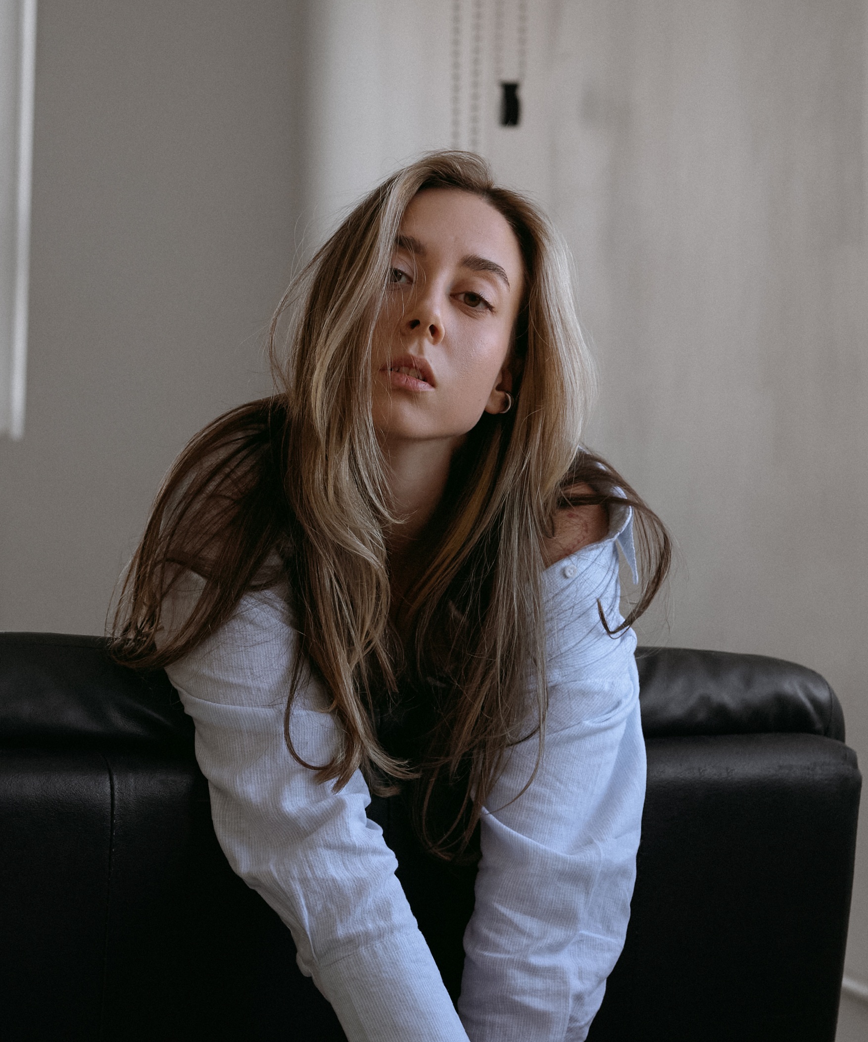 Julia Buzatti sitting on a black chair